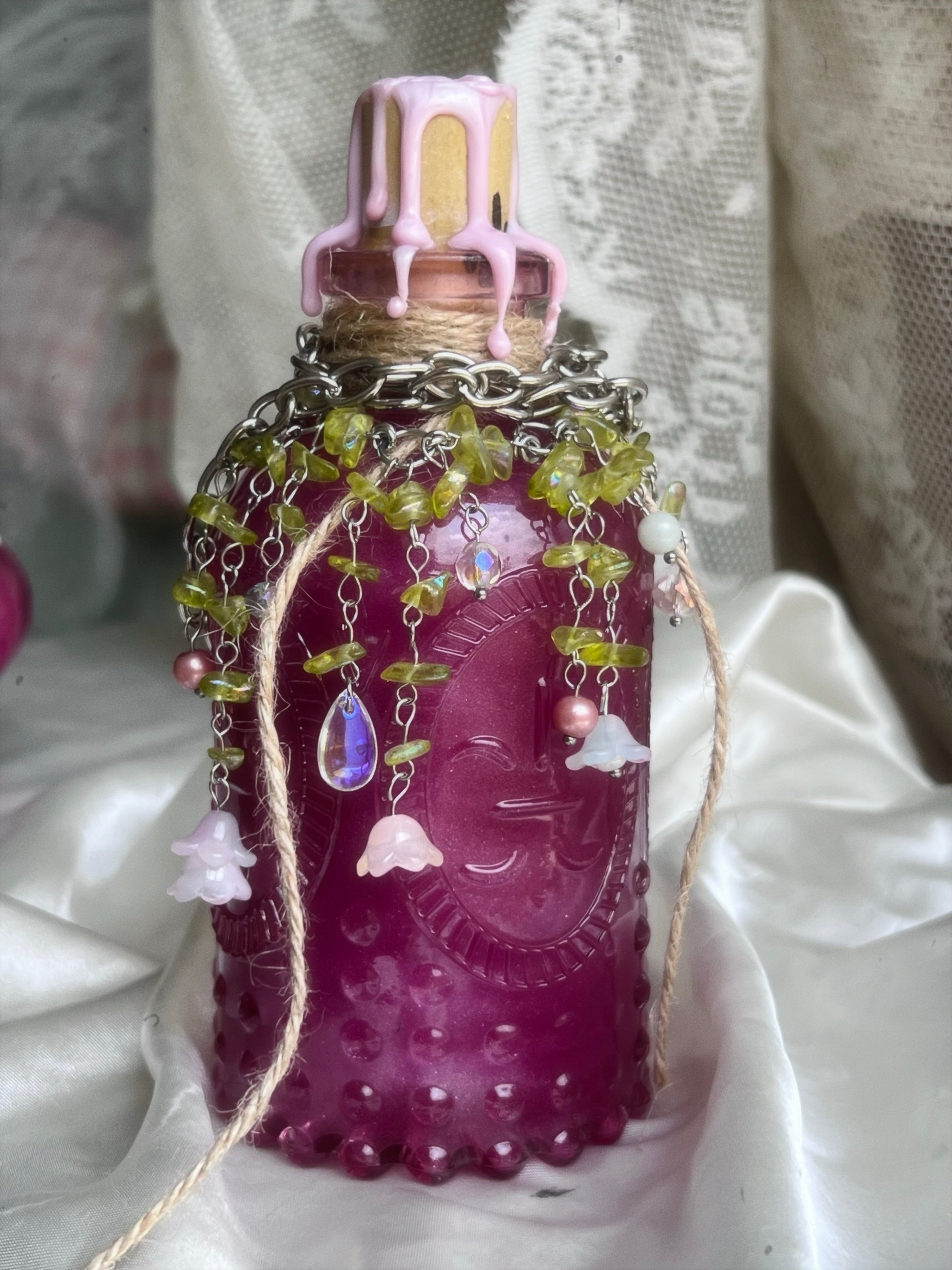 Potion display with lush forest necklace
