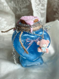 Jewelry display potion with teddy necklace